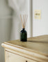 Reed Diffuser on wooden chest of drawers
