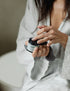 Woman taking Face Mask | Revive & Balance from pot with finger tips