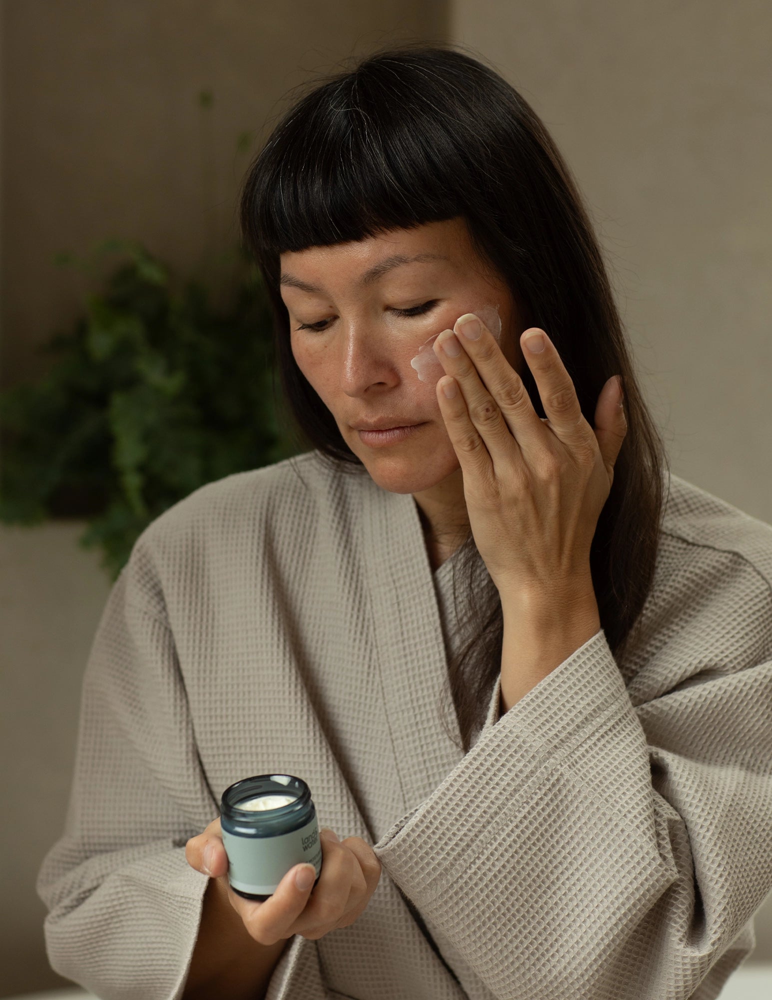 Woman applying Face Moisturiser for sensitive skin