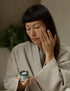 Woman applying Face Moisturiser for sensitive skin