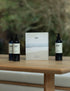 Body wash, shampoo and conditioner, and gift set box on wooden table