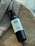 Face Toner lying on a wooden stool