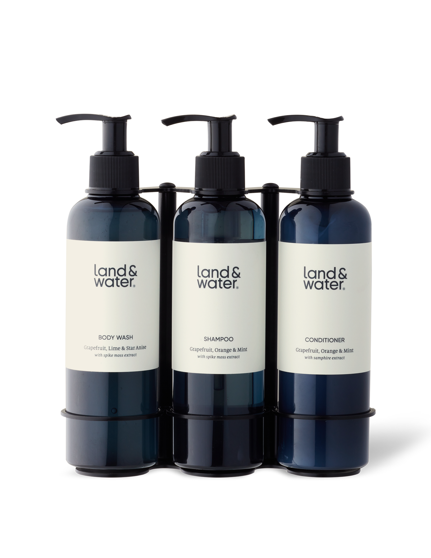 Three bottles in a black stainless steel wall-mounted bracket.