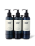 Three bottles in a black stainless steel wall-mounted bracket.