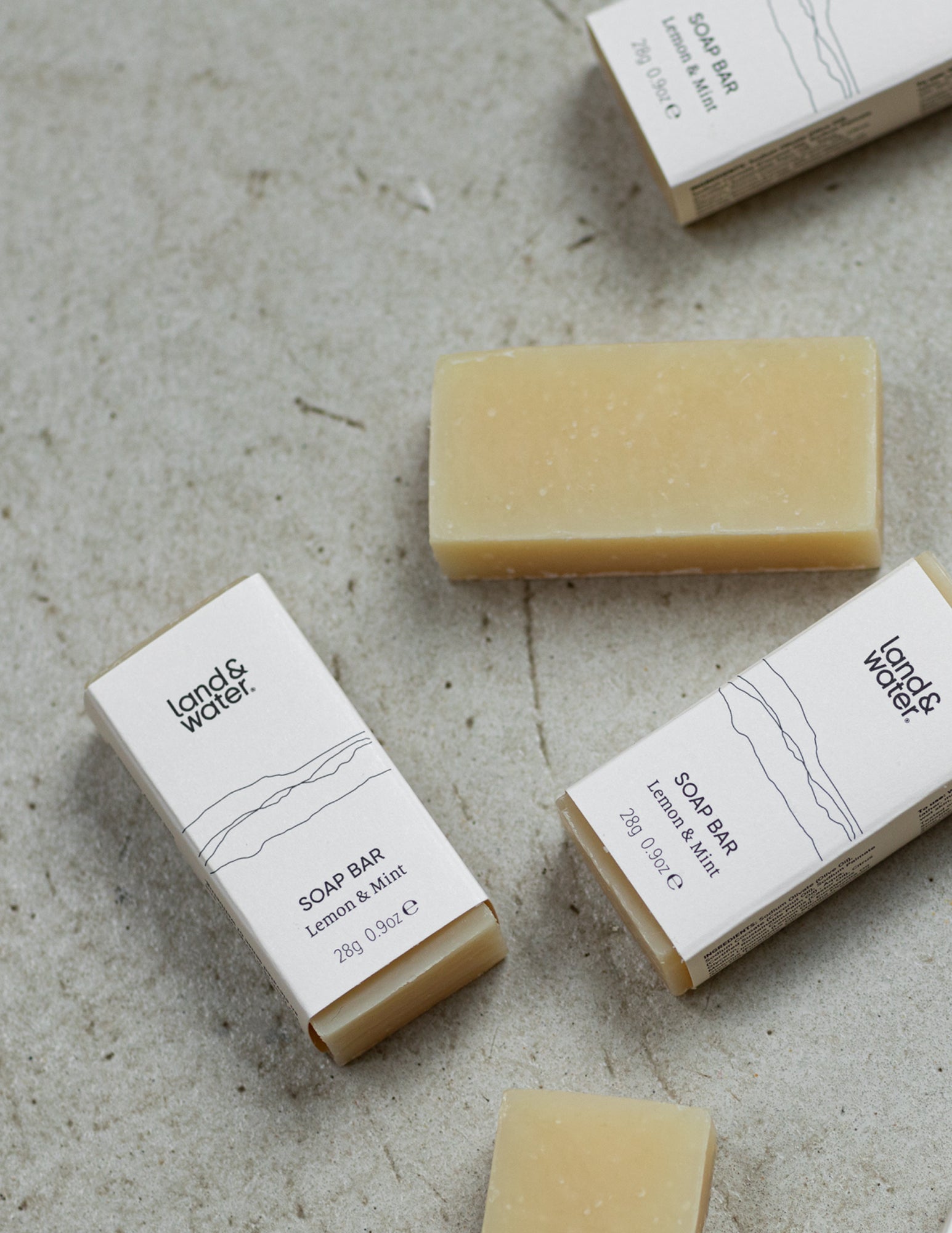 mini soap bars on a granite surface
