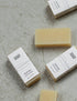 mini soap bars on a granite surface