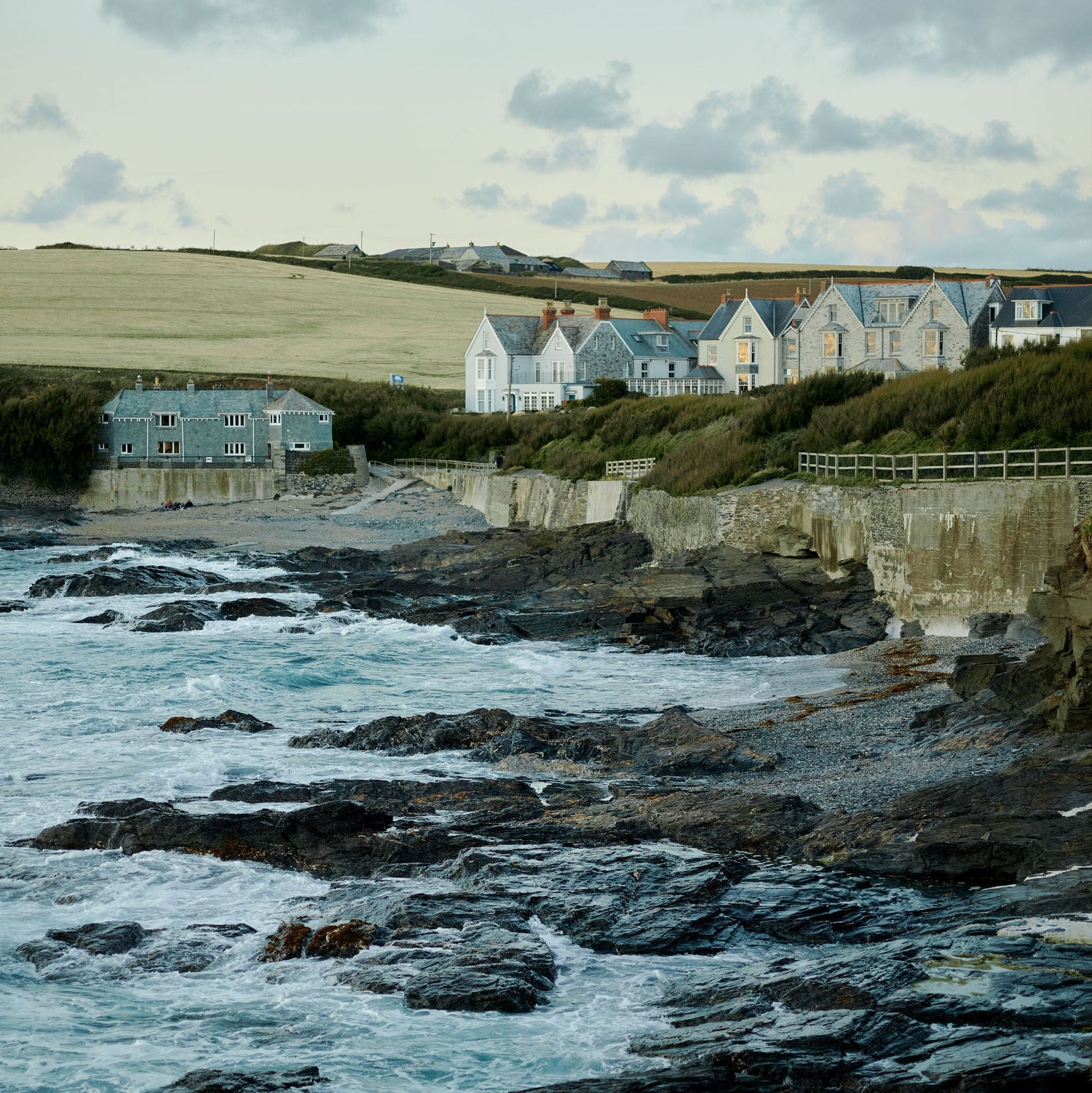 The coast with rocks and seat and houses lined up