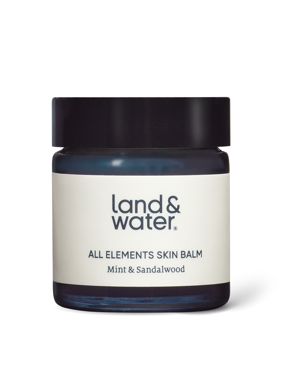 All Elements Skin Balm in a glass 30ml jar with lid, against a white backdrop.