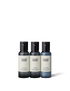 Three travel-sized bottles of body wash, shampoo and conditioner. 